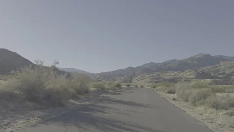 Driving in desert backround -  log c Stock Footage 262482173