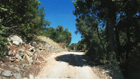 Driving up a dirt road Stock Footage 128858985