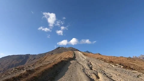 Driving on a dirt road to Mount Ushba Stock Footage 150236629