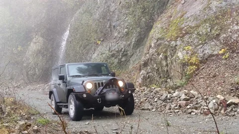 Driving up dirt road from waterfall Stock Footage 172563602