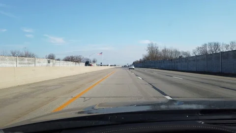 Driving Down American Freeway With Big American Usa Flag On Left Hand Side P Stock Footage 126231274