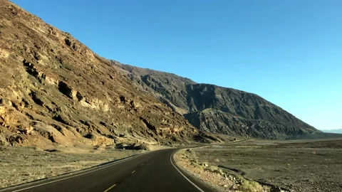 Driving Down American Road With Large Colourful Mountain On Left Screen Stock Footage 234005632