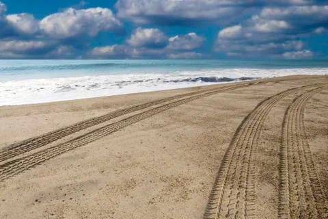 Driving down the beach Stock Photos