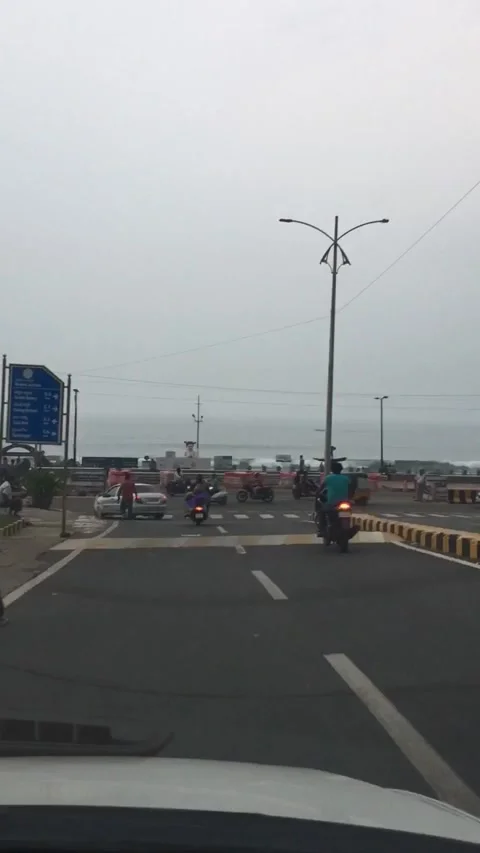 Driving down on to beach road Vizag Stock Footage 137022242