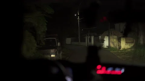 Driving down Caribbean road at night Stock Footage 137960354