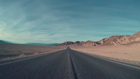 Driving Down Center Of Desert Road, Then Car Transitions To Right Lane Video stock 69872850