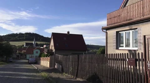 Driving down cobble road in small village Stock Footage 68350426