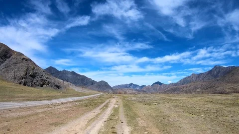 Driving down a country road through the hills Stock Footage 107975488