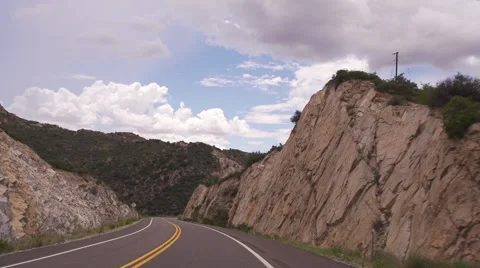 Driving Down a Curvy Road in the Mountains Stock Footage 51677225