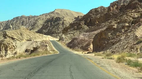 Driving down a desolate Spanish Desert country road Stock Footage 237808904