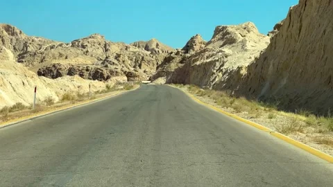 Driving down a desolate Spanish Desert country road Stock Footage 237808930
