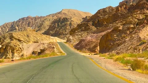Driving down a desolate Spanish Desert country road Stock Footage 239743109