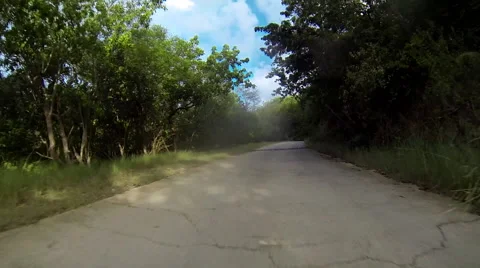 Driving down a dirt road Stock Footage 41476829