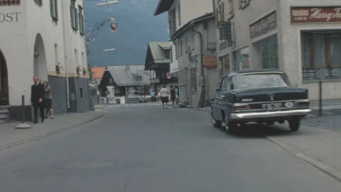 Driving Down Dorfstrasse In Grindelwald Alpine Village Switzerland 1970s Vídeo Stock 342603781