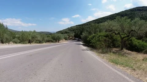 Driving down empty winding mountain highway 스톡 동영상 145955910