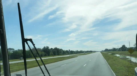 Driving Down Highway on Bus Looking Out Window Blue Skies, 4K Stock Footage 61510871