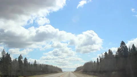 Driving down the highway looking at the clouds Stock Footage 146666040