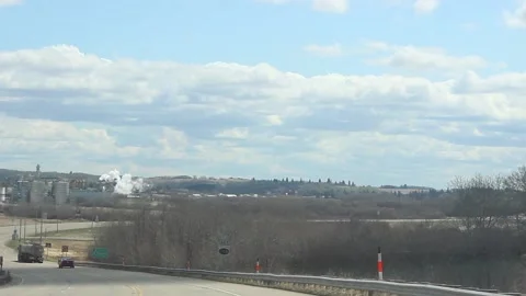 Driving down a highway ramp towards an industrial block Stock Footage 146808630