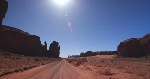 Driving Down Hot Dirt Road In Monument Valley Arizona Stock Footage 202218162