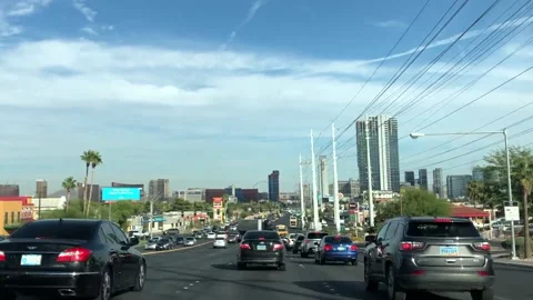 Driving Down Las Vegas Highway In Traffic With City In Distance On Sunny Day Stock Footage 235498086