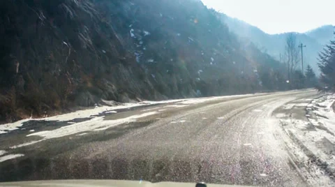 Driving down the mountain road with snow Видео 35840959