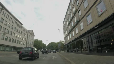 Driving down a Munich street on a workday in Germany Stockbeeldmateriaal 192070037