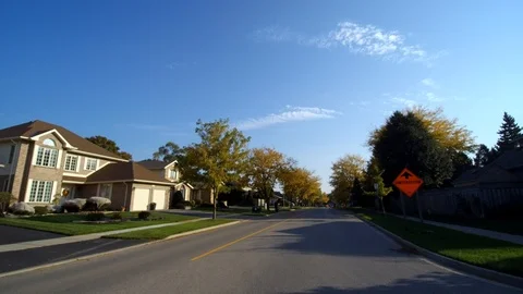 Driving Down Neighborhood Middle Class Houses Sunny Day 002 Stock Footage 121196129