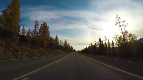Driving down a quiet rural highway during the day in autumn. Stock Footage 82412834