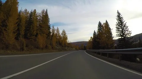 Driving down a quiet rural highway during the day in autumn. Stock Footage 83097620