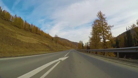 Driving down a quiet rural highway during the day in autumn. Stock Footage 84257006