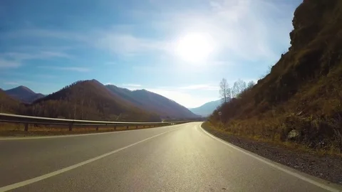 Driving down a quiet rural highway during the day in autumn. Stock Footage 84871192