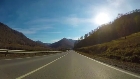 Driving down a quiet rural highway during the day in autumn. Stock Footage 84883211