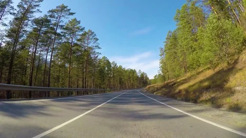 Driving down a quiet rural highway during the day in autumn. Stock Footage 84891097