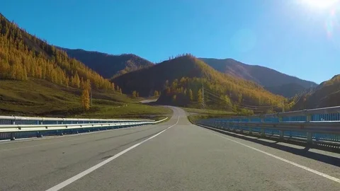 Driving down a quiet rural highway during the day in autumn. Chuysky tract Stock Footage 96180308