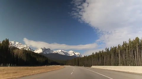 Driving down the road overlooking the Rockies late October Mid Day 動画素材 82181459