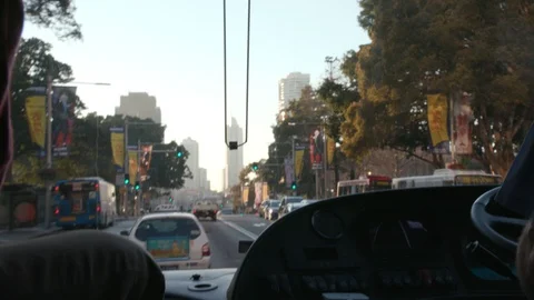 Driving down a road with sky scrapers in the distance Stock Footage 106591736