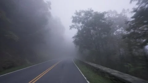 Driving Down A Road With Thick Fog Stock Footage 258961638