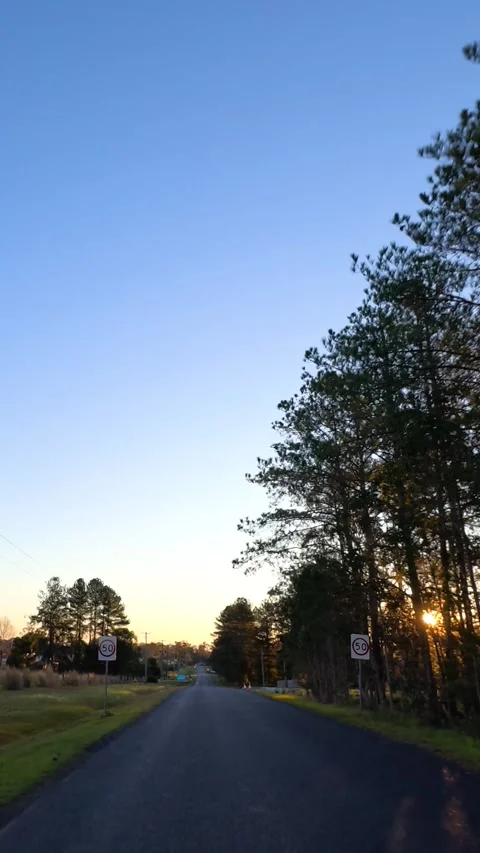 Driving Down a Rural Asphalt Road at Sunset in Australia Stock Footage 340374349