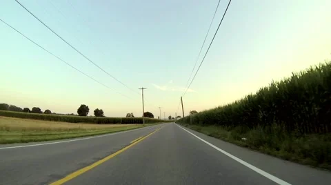 Driving Down a Rural Road Stock Footage 59339497
