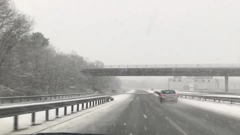 Driving down snowy motorway Stock Footage 147328201