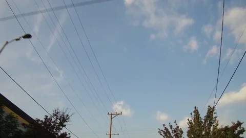 Driving Down The Street Looking Up At Power Lines &amp; Street Lamps Stock Footage 72681517