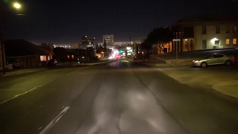 Driving down the street towards downtown El Paso at night Video stock 81812257