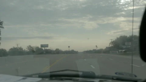 Driving Down a Suburban Highway on an Overcast Day Stock Footage 343880651
