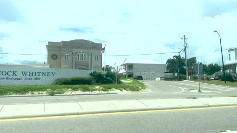 Driving by Down Town Pass Christian Mississippi by beach 4k 30fps 10 bit Stock Footage 202742455