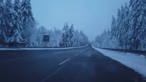 Driving from a driver's perspective on a wintry country road - Part 3 Stock Footage 273239929