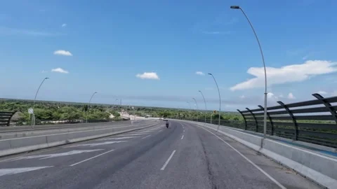 Driving Elevated Highway with Distant Town View 库存影片 341369068