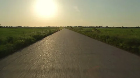 Driving on an empty asphalt road at sunset HD 24 fps Stock Footage 49965899