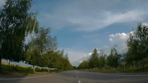 Driving on an empty asphalt road with white markings passing Stock Footage 133130126