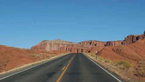 Driving On Empty Country Road Going Into Distance To Red Mountain Rocks Massive Stock Footage 236902984