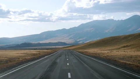 Driving On An Empty Highway In The Hilly Mountains And Dried Desert 스톡 동영상 167079485